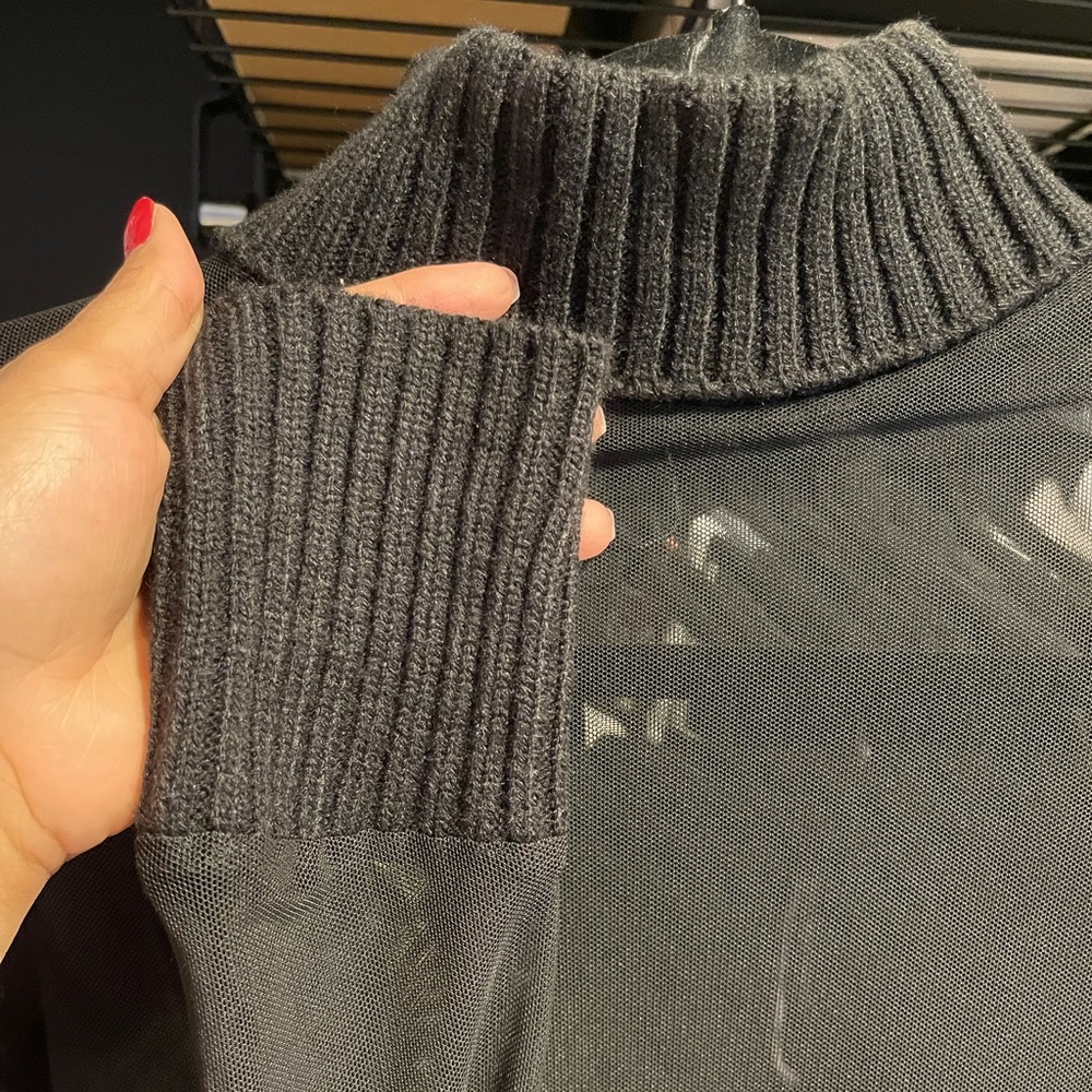 Black transparent turtleneck top.